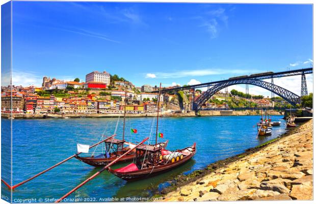 Oporto skyline, Douro river, traditional boats and iron bridge. Canvas Print by Stefano Orazzini