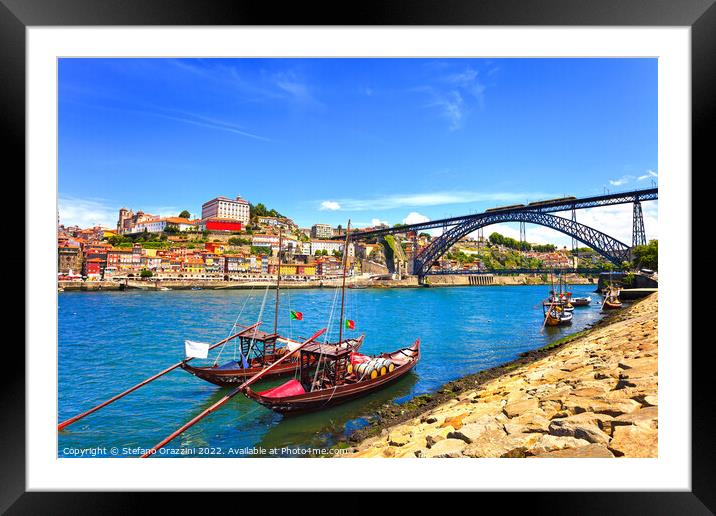 Oporto skyline, Douro river, traditional boats and iron bridge. Framed Mounted Print by Stefano Orazzini