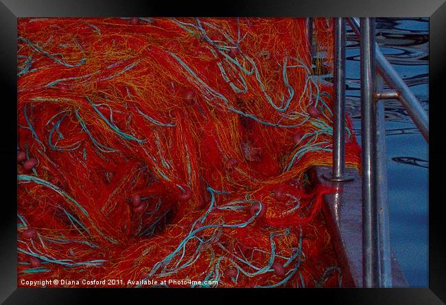 Red fishing nets over railings Framed Print by DEE- Diana Cosford