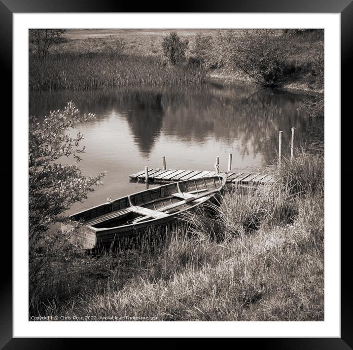 Traditional rowing boat moored Framed Mounted Print by Chris Rose