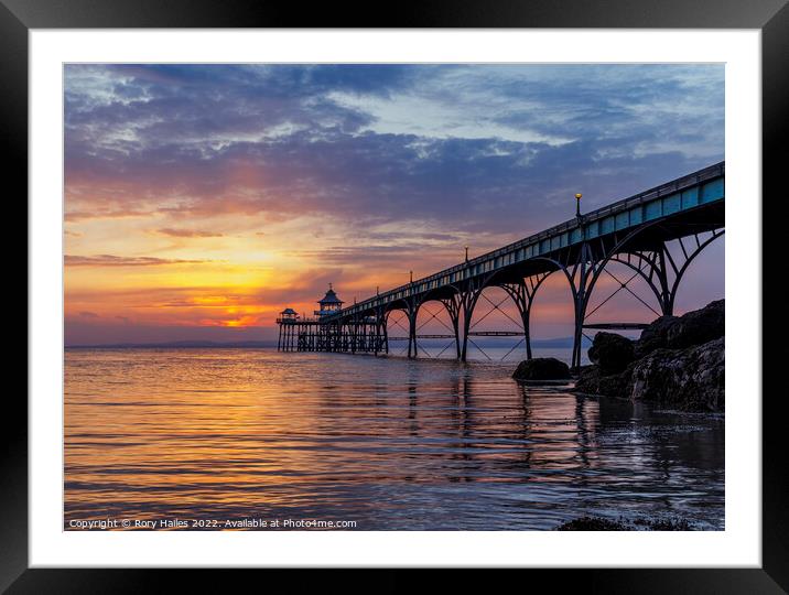 Pier at sunset with golden sunlight Framed Mounted Print by Rory Hailes