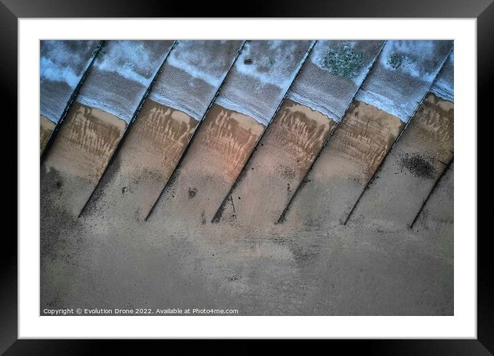 Snowy Beach Groynes Framed Mounted Print by Evolution Drone