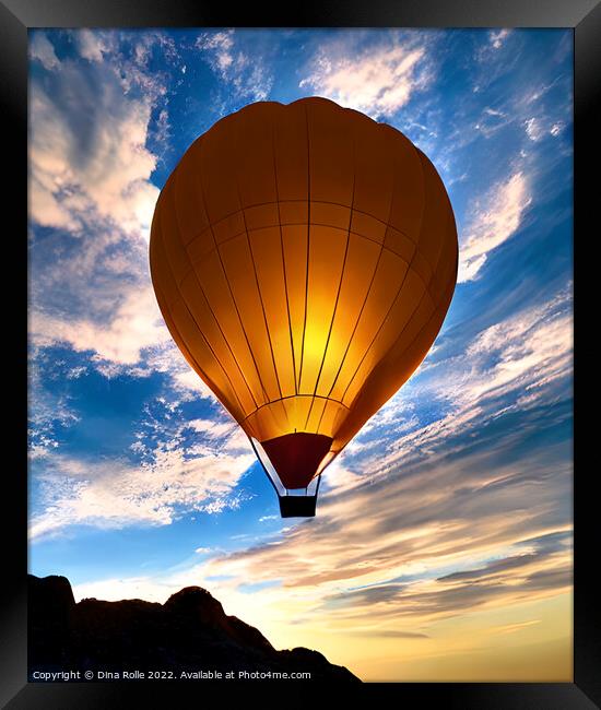 Hot Air Balloon Flying over Rocky Mountaintop at Sunset Framed Print by Dina Rolle