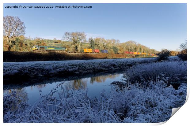 Freightliner passes the white frozen landscape of the river Avon near Freshford Print by Duncan Savidge