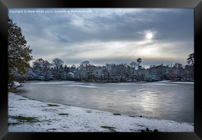 Icy lake in Surrey Framed Print by Kevin White