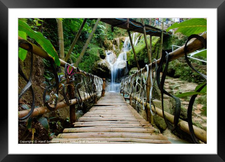 Bamboo bridge to Mudal waterfall Framed Mounted Print by Hanif Setiawan