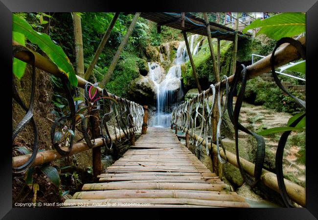 Bamboo bridge to Mudal waterfall Framed Print by Hanif Setiawan