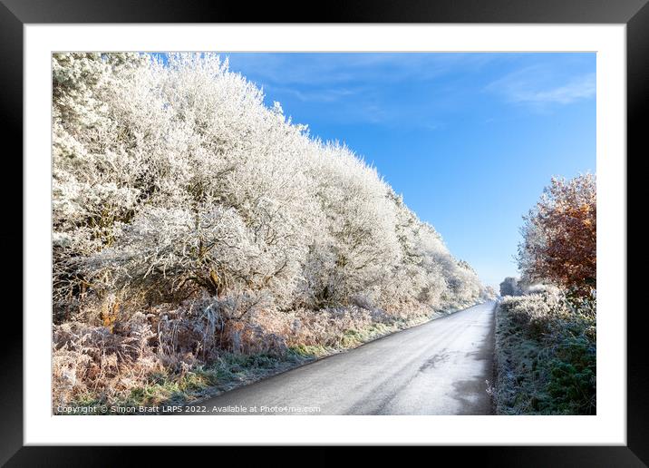 Amazing frozen trees on rural icy UK road Framed Mounted Print by Simon Bratt LRPS