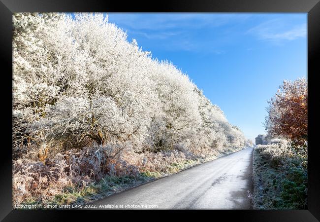 Amazing frozen trees on rural icy UK road Framed Print by Simon Bratt LRPS