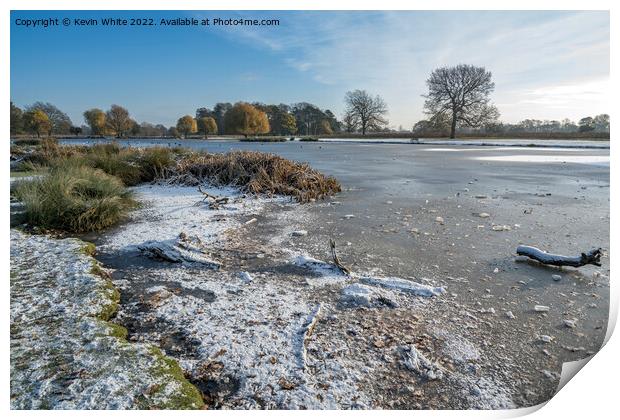 Icy lake  with a sprinkle of snow Print by Kevin White