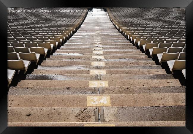 Detail of the empty stands of a large sports stadium, without at Framed Print by Joaquin Corbalan