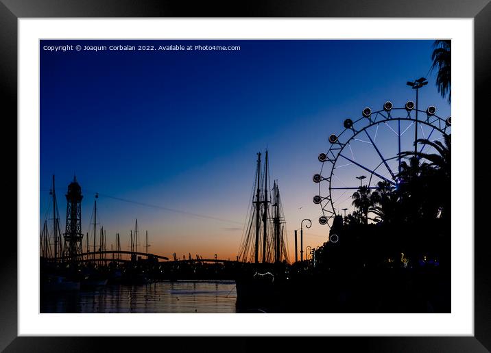 Sunset in the port of Barcelona, with ferris wheel in the backgr Framed Mounted Print by Joaquin Corbalan