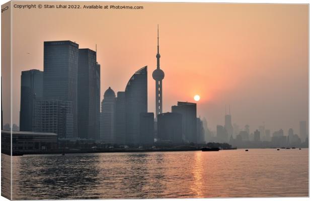 Sunset over the Huangpu river in Shanghai Canvas Print by Stan Lihai