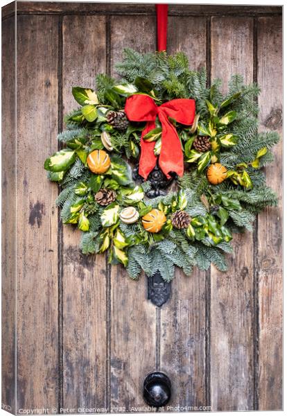 Traditional English Christmas Wreath On A Wooden Farmhouse Door Canvas Print by Peter Greenway