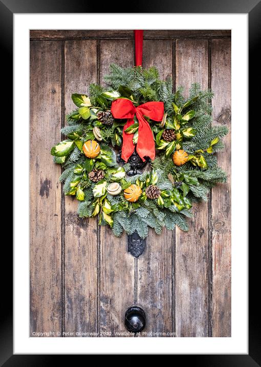 Traditional English Christmas Wreath On A Wooden Farmhouse Door Framed Mounted Print by Peter Greenway