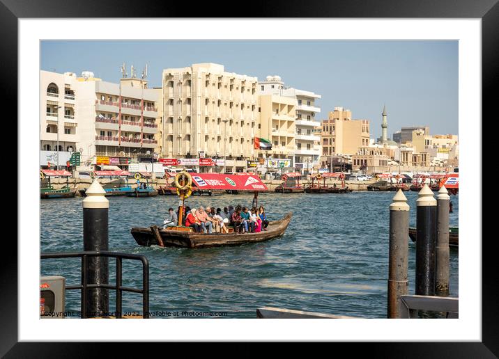 Passenger ferry boat on Dubai Creek. Framed Mounted Print by Chris North