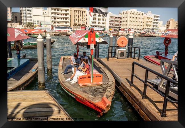 Water taxi on Dubai creek. Framed Print by Chris North