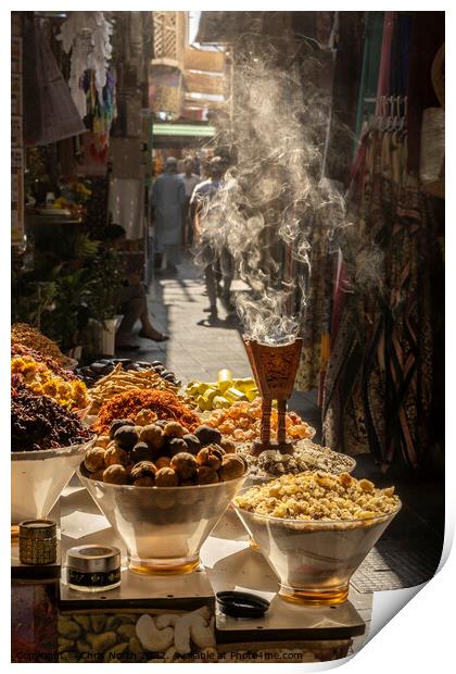 Aromatic herbs smouldering at the spice souk in Dubai. Print by Chris North