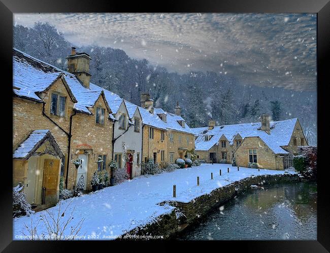 Castle Combe in the snow Framed Print by Graham Lathbury