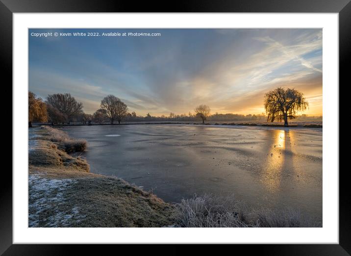 Lake iced over on a  December sunrise Framed Mounted Print by Kevin White