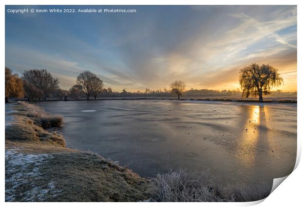 Lake iced over on a  December sunrise Print by Kevin White