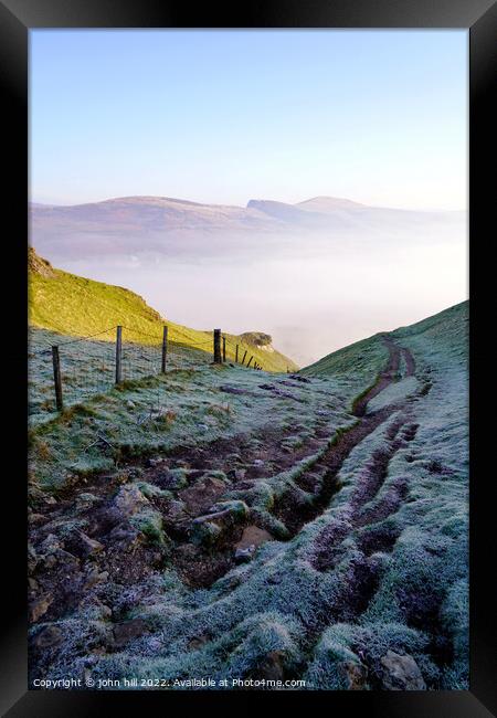 Looking down to a misty Winnats pass, Derbyshire. Framed Print by john hill