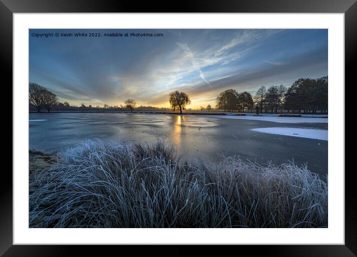 Rising sun over the blue frozen ice Framed Mounted Print by Kevin White