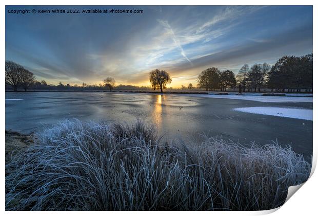 Rising sun over the blue frozen ice Print by Kevin White