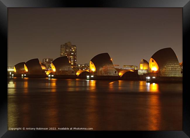 Thames Barrier lit up at night Framed Print by Antony Robinson