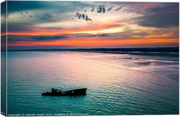 Sunset Over Shipwreck Canvas Print by Malcolm Wood