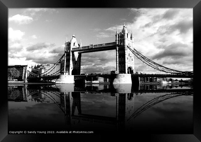 Towering Reflections of London Bridge Framed Print by Sandy Young
