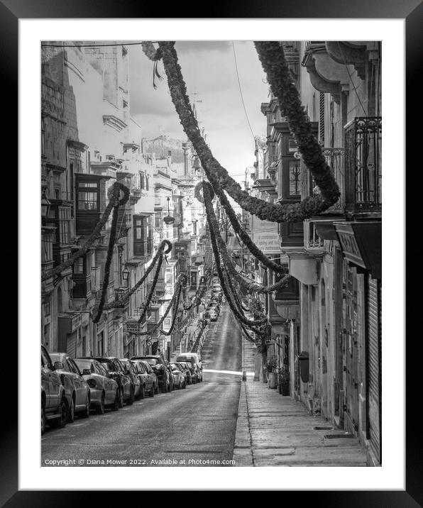 Valletta Street Festival time monochrome Framed Mounted Print by Diana Mower