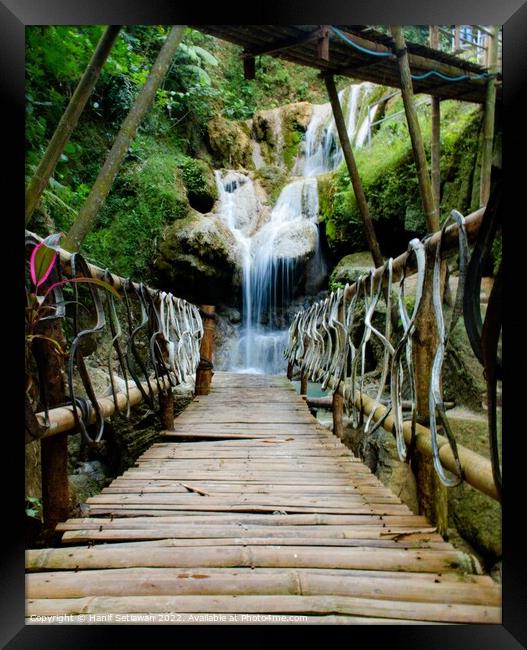 Bamboo footbridge to waterfall - vertical Framed Print by Hanif Setiawan