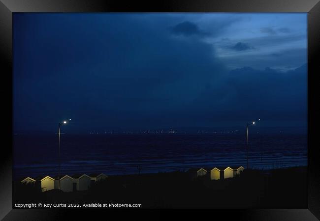 Beach Huts at Night Framed Print by Roy Curtis