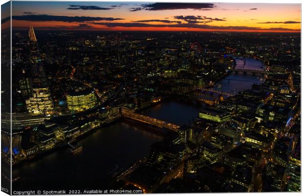 Aerial illuminated London city the financial business center  Canvas Print by Spotmatik 