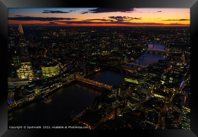 Aerial illuminated London city the financial business center  Framed Print by Spotmatik 