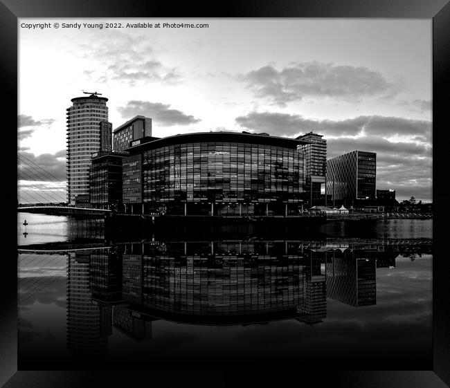 Moody Manchester Quayside Framed Print by Sandy Young
