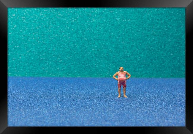 Tiny Swimmer Takes on the Beach Framed Print by Steve Purnell