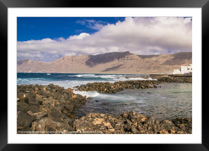 Caleta de Famara, a small seaside town in Lanzarot Framed Mounted Print by Michael Shannon