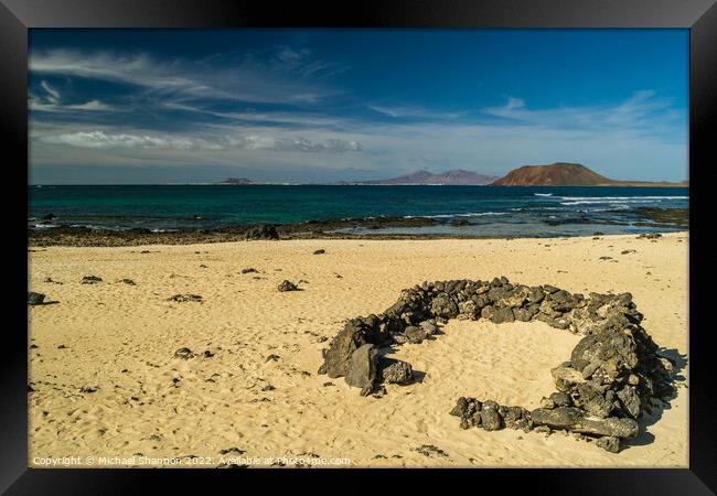 Looking out to sea from one of Corralejo's beaches Framed Print by Michael Shannon