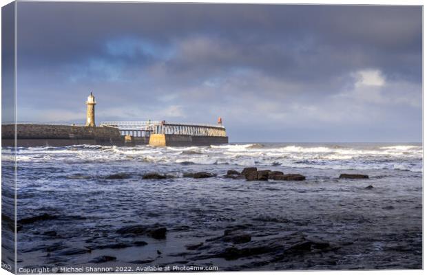 East Pier - Whitby on a stormy day Canvas Print by Michael Shannon