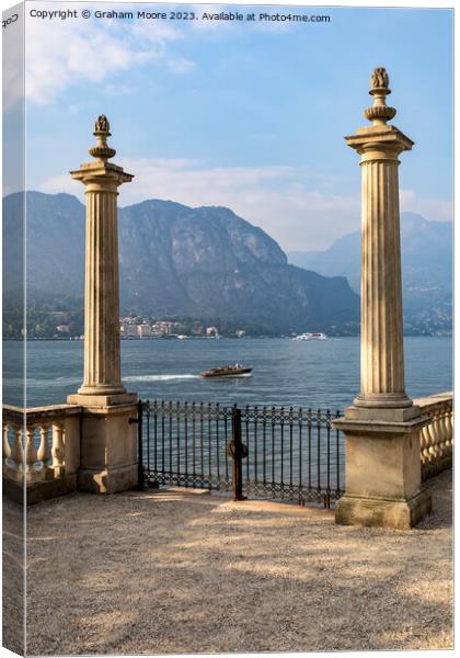 Lake Como terrace  and motorboat Canvas Print by Graham Moore