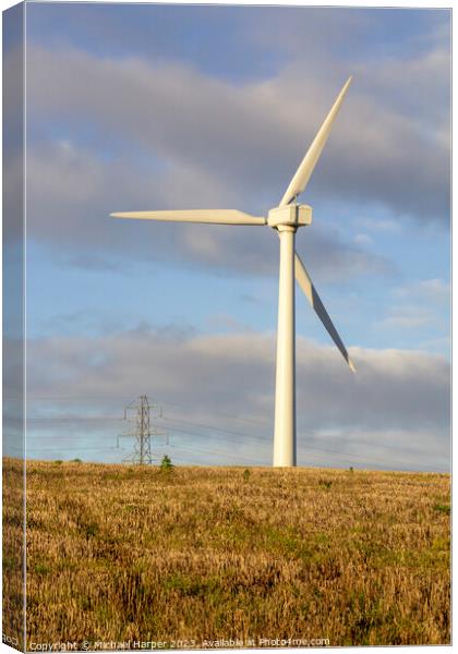 A modern zero emmissions wind turbine located on the road from N Canvas Print by Michael Harper