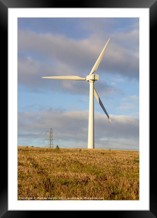 A modern zero emmissions wind turbine located on the road from N Framed Mounted Print by Michael Harper