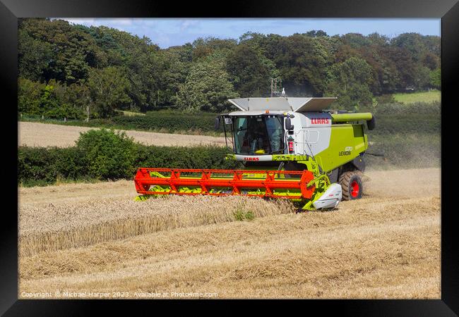 A Cllaas lexion 570 Combine Harvester  Framed Print by Michael Harper