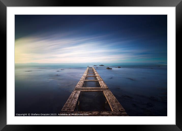 Wooden pier remains in a blue sea. Long Exposure. Framed Mounted Print by Stefano Orazzini