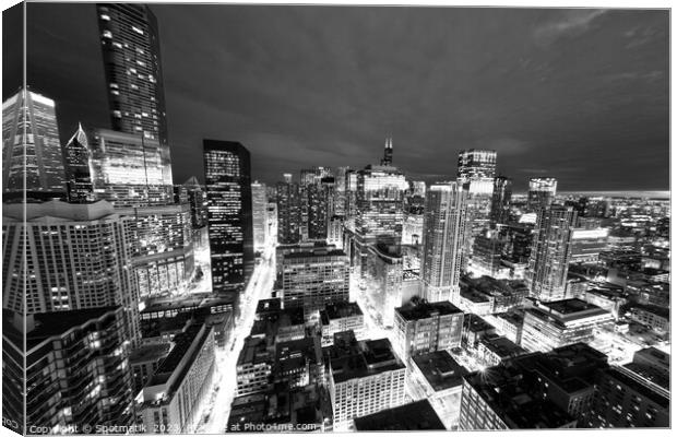 Aerial Chicago skyscrapers illuminated at night  Canvas Print by Spotmatik 