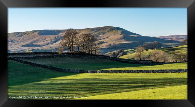 A large green field with a mountain in the background Framed Print by Gail Johnson