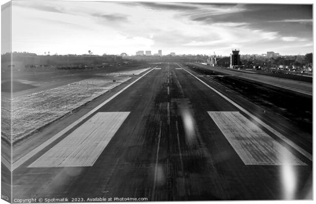 Aerial POV of aircraft landing on airport runway  Canvas Print by Spotmatik 
