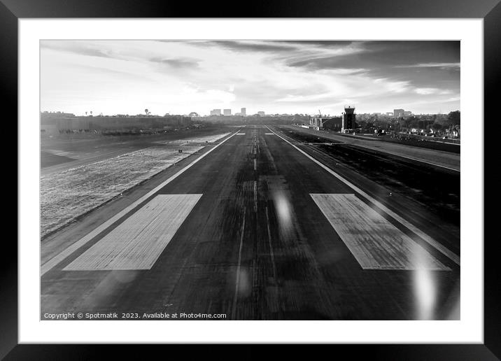 Aerial POV of aircraft landing on airport runway  Framed Mounted Print by Spotmatik 